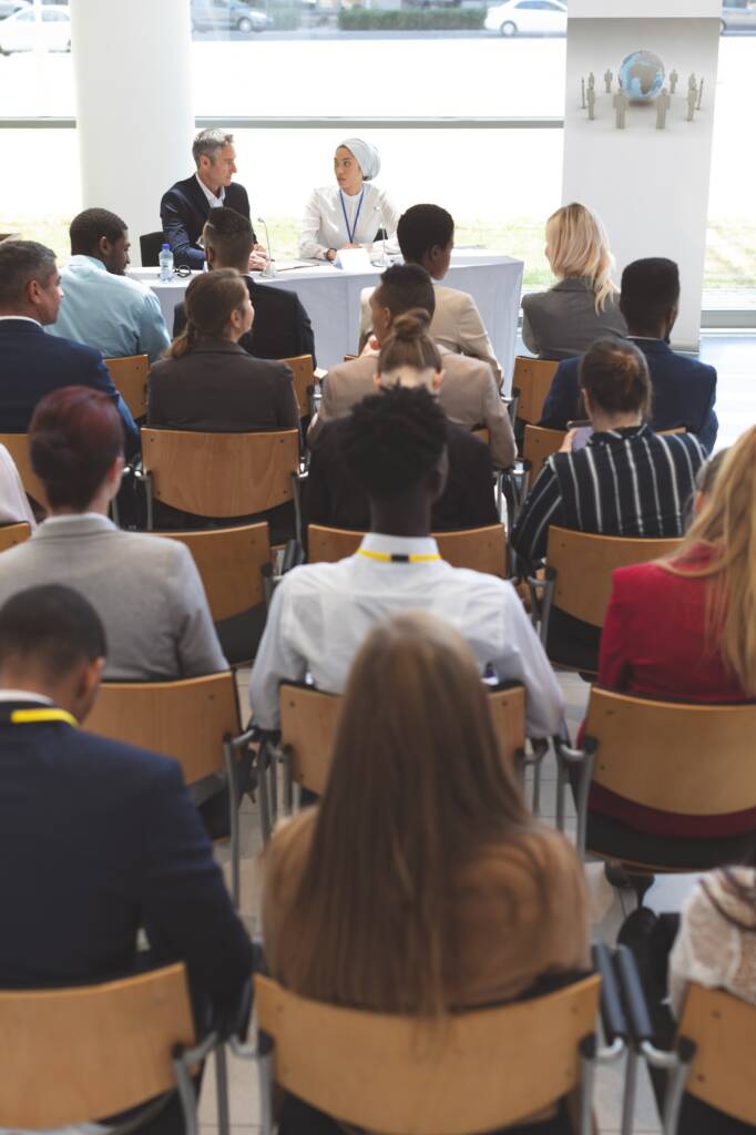 Group of business people waiting while attending a business seminar in office building